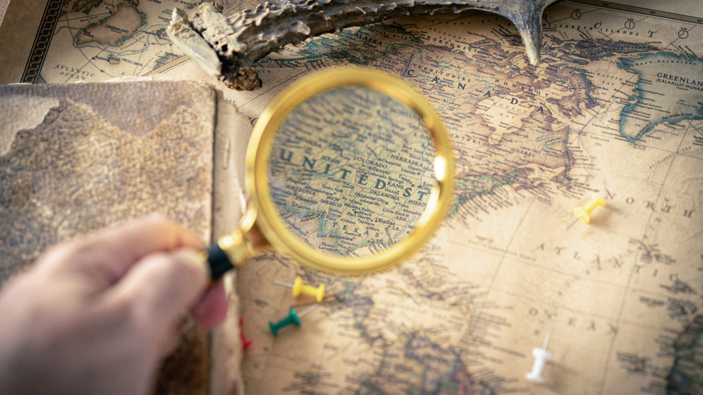 Magnifying glass searches over the United States
