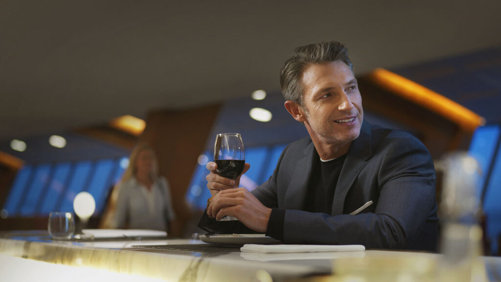 Gentleman in Qantas First Lounge with Platinum One status