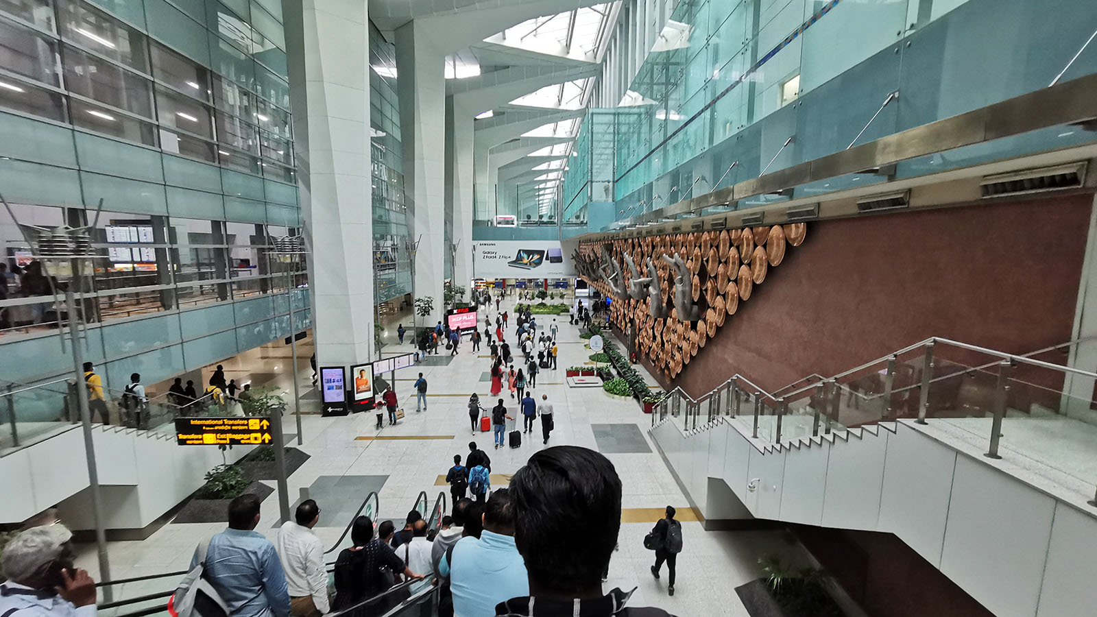 Walking through Delhi's Indira Gandhi International Airport after an Air India A320neo Business Class flight