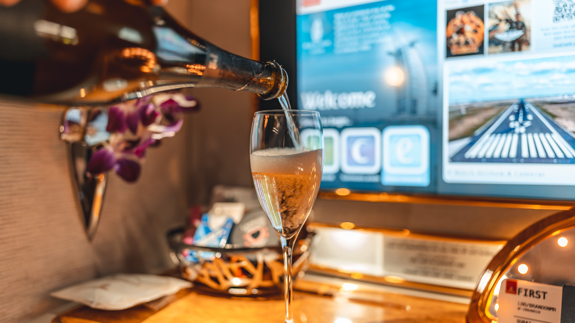Emirates Boeing 777 First class pouring Champagne