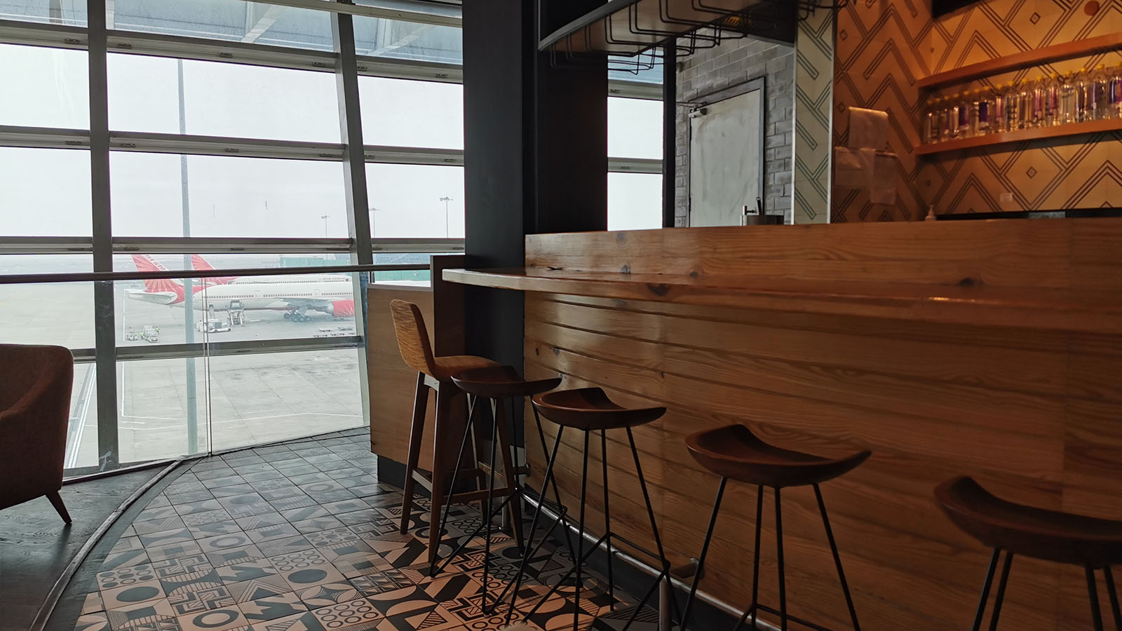 Coffee shop with an airport view at Delhi Airport