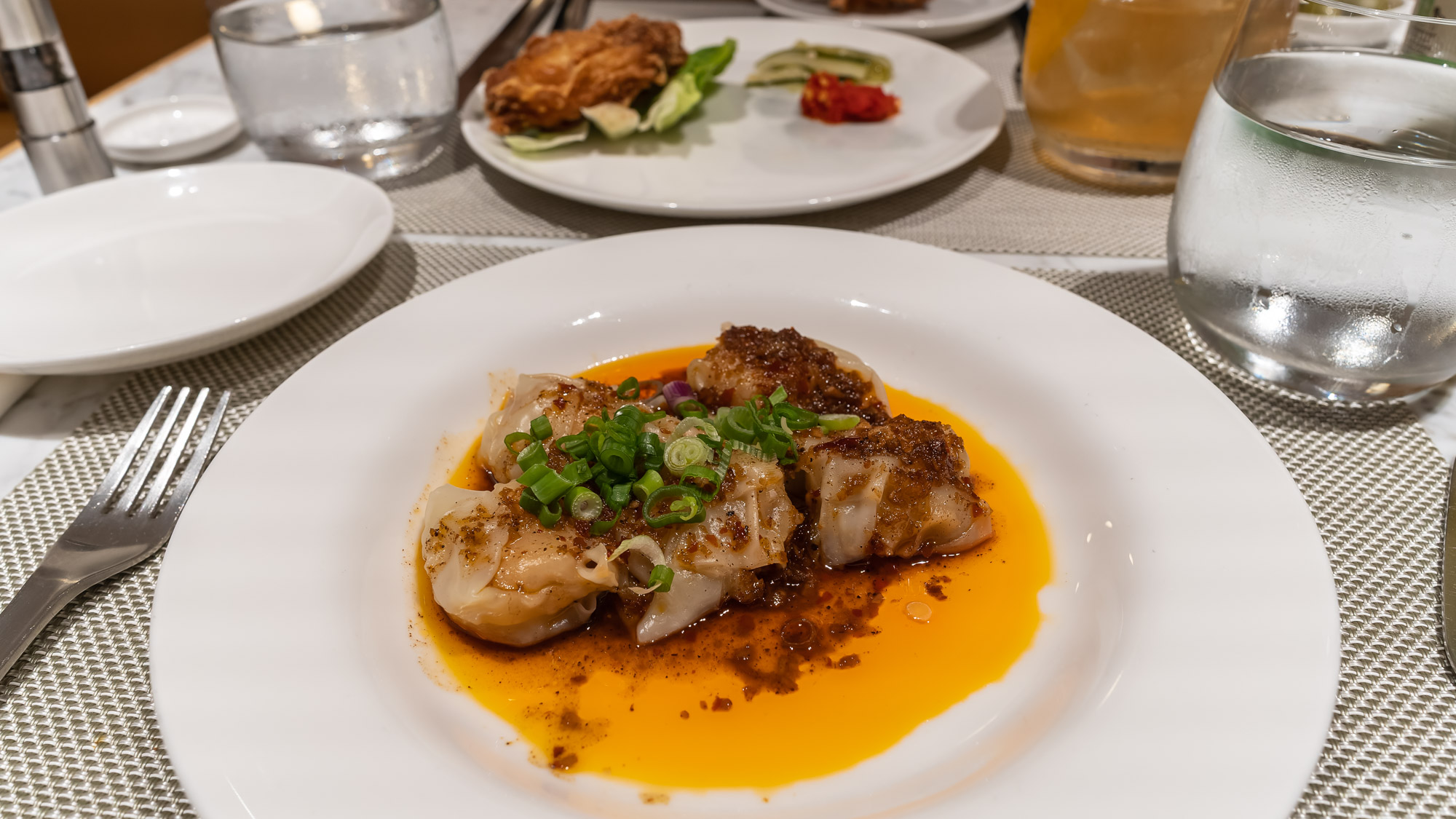 Qantas Singapore First Lounge dining prawn wontons