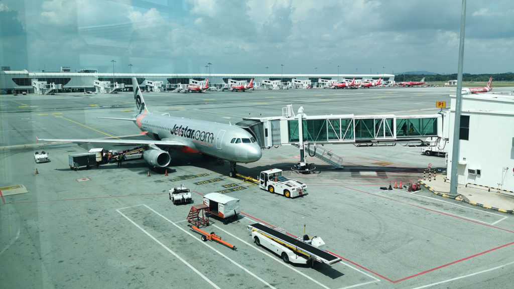 Jetstar Asia Airbus A320 with Economy parked at the gate