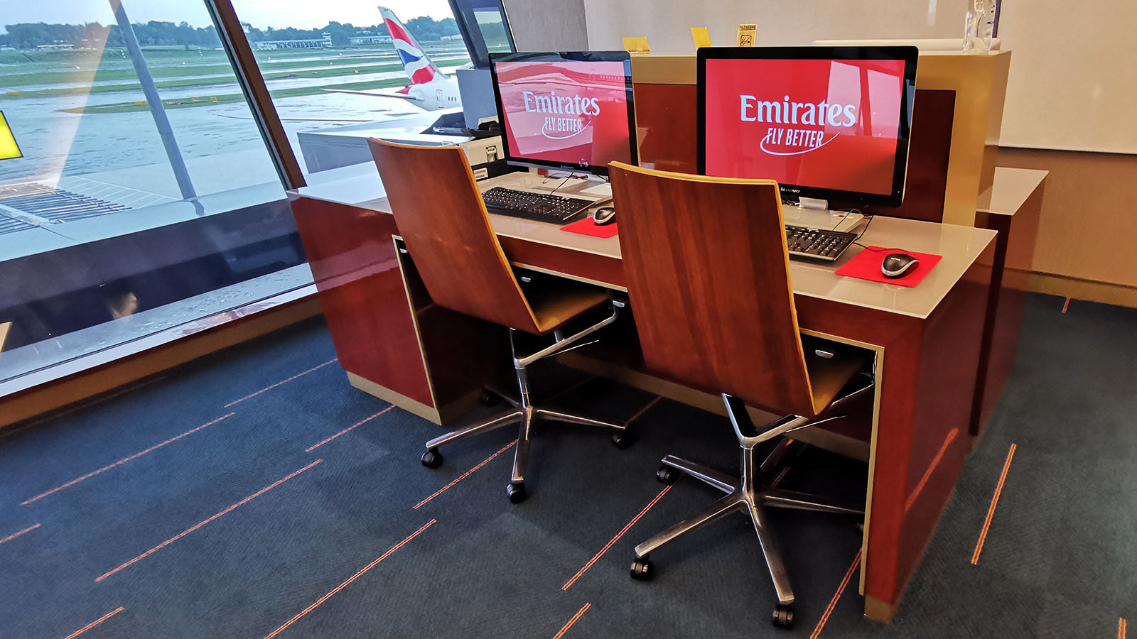 Computers at business centre inside the Tan seating at the Emirates Lounge, Singapore