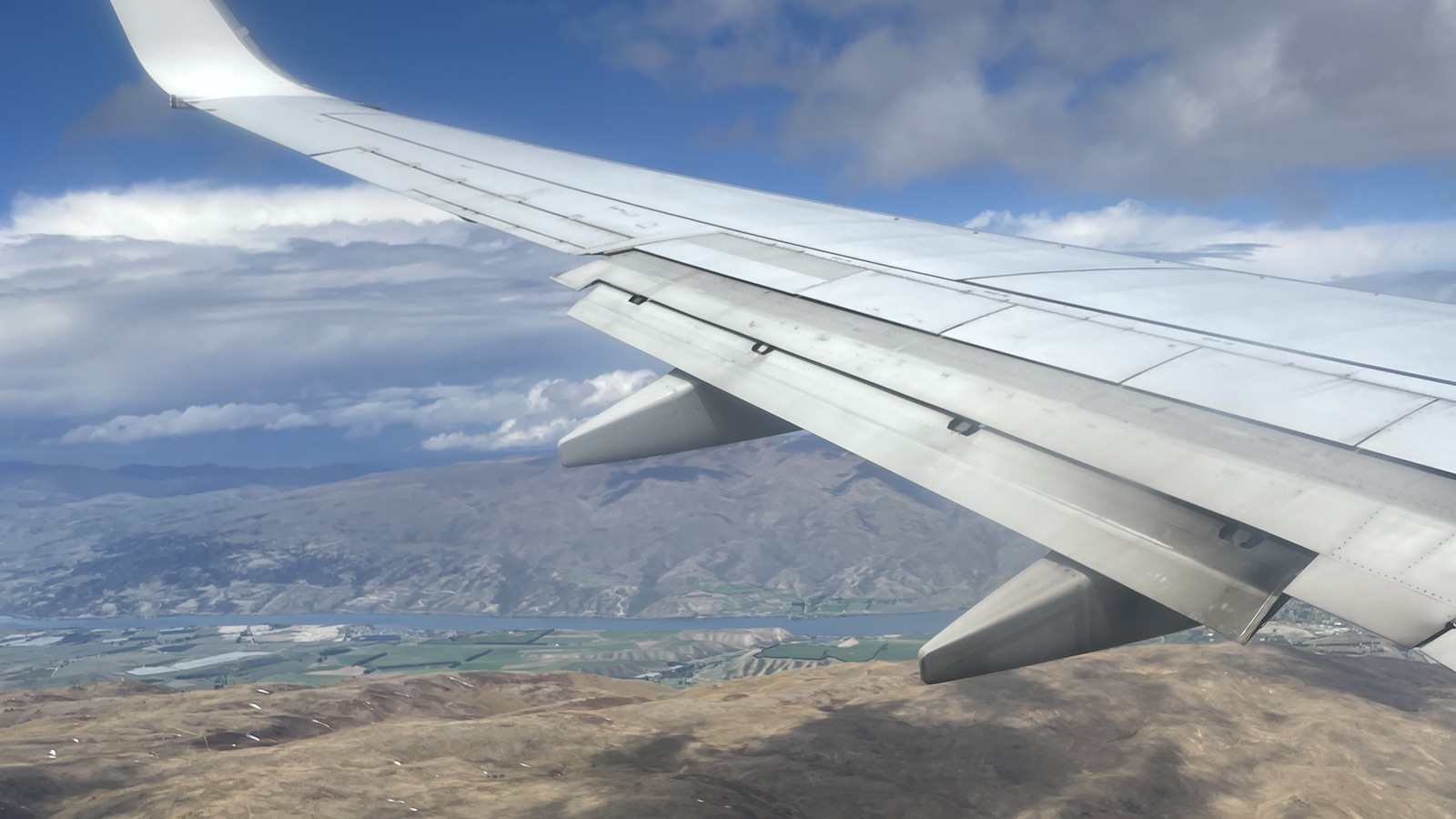 Virgin Australia plane landing Queenstown Wing View