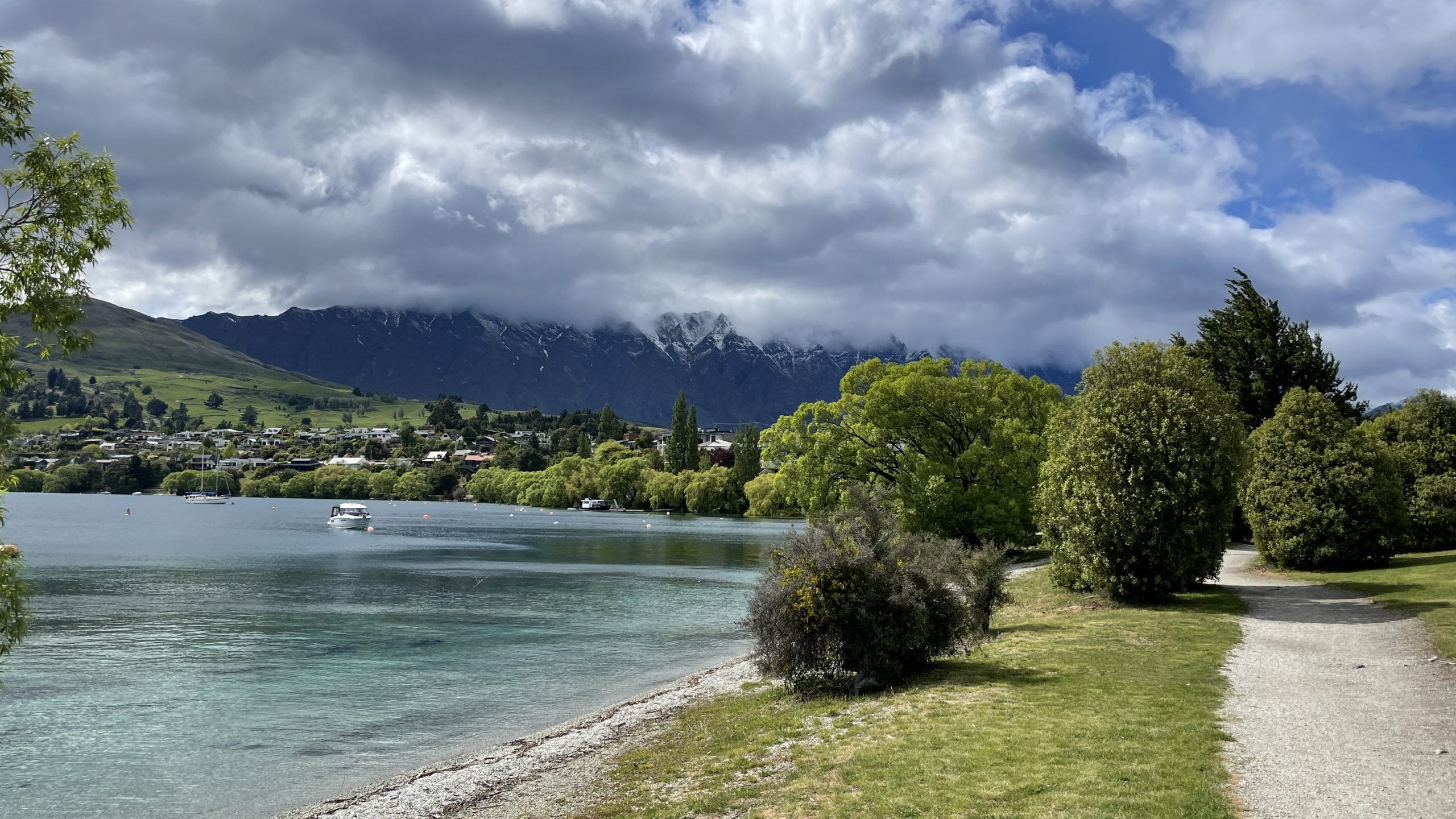 Queenstown lake cloud covered mountains