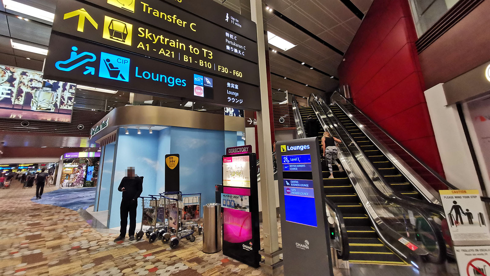 Escalator up to the Qantas International Business Lounge in Singapore