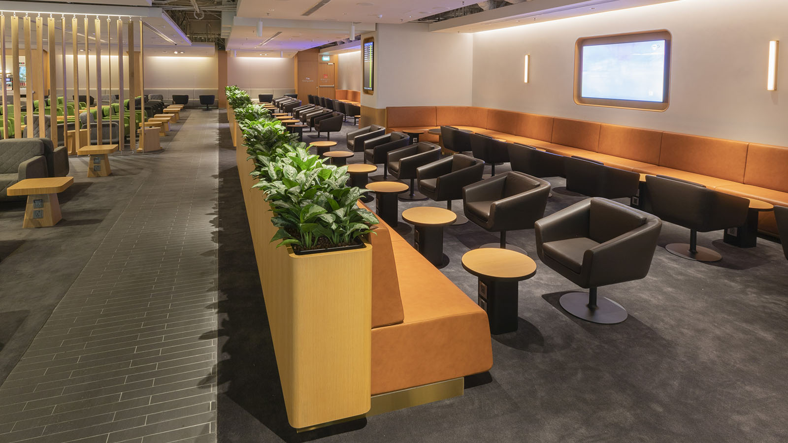 Orange and black seats at the Qantas International Business Lounge in Singapore