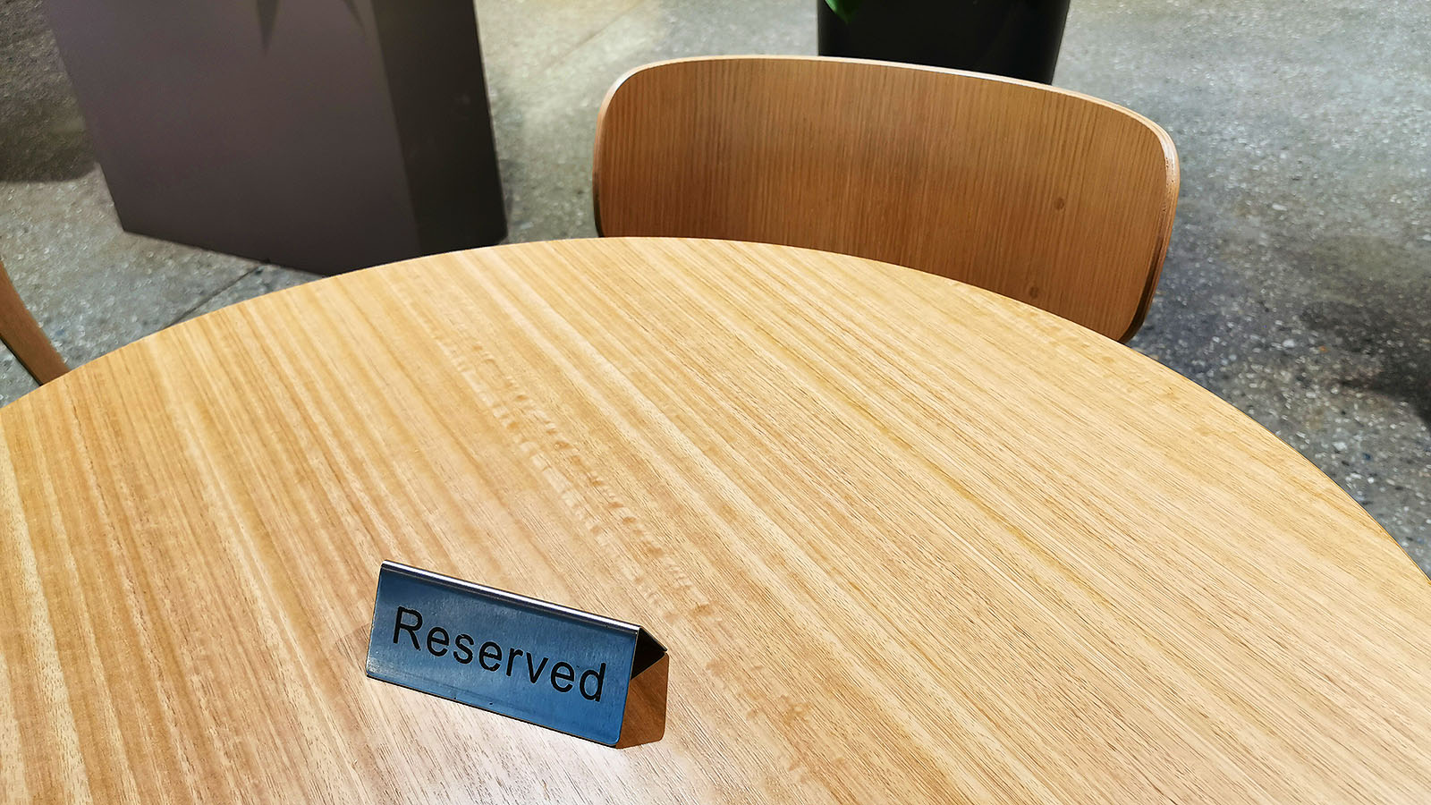Reserved sign on a dining table at the Qantas International Business Lounge in Singapore