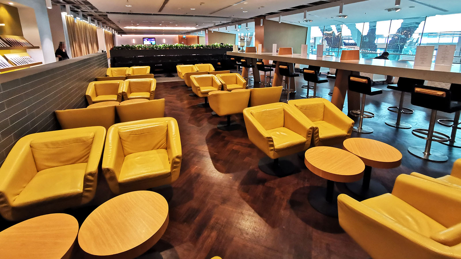 Yellow coloured seats at the Qantas International Business Lounge in Singapore
