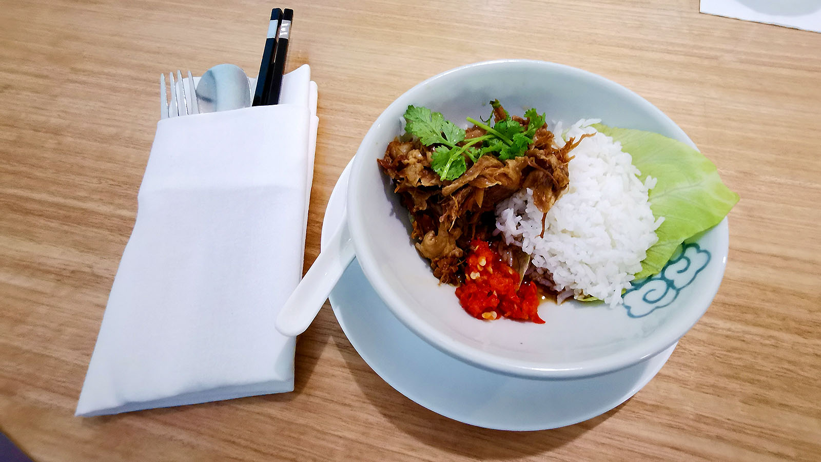 Braised pork knuckle dish at the Qantas International Business Lounge in Singapore