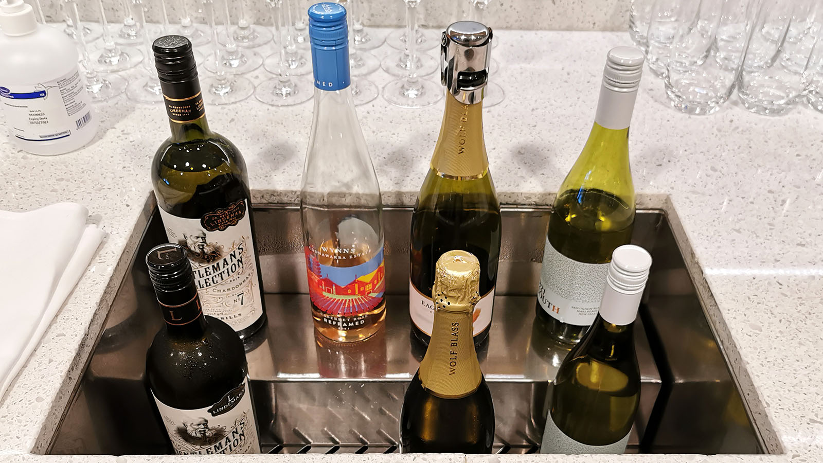 White wine in bottles at the Qantas International Business Lounge in Singapore