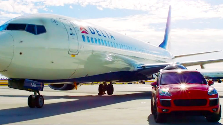 Porsche on the tarmac, waiting to collect a Delta 360° member