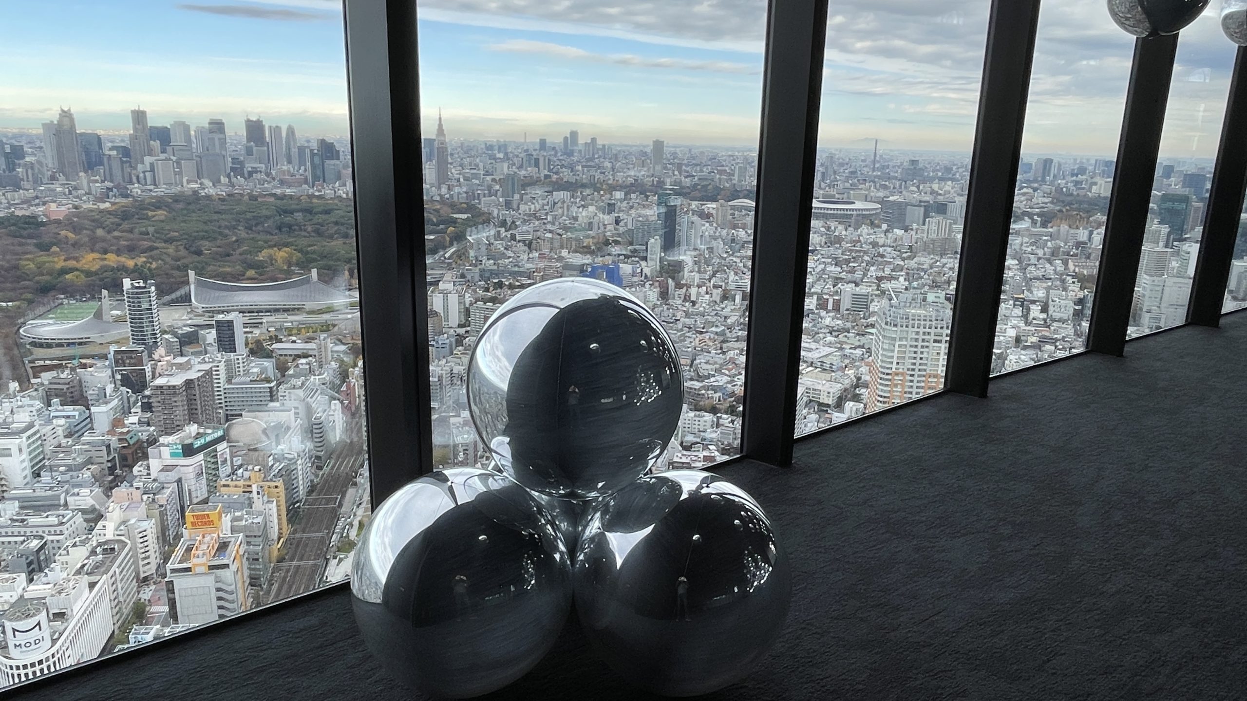 Shibuya Sky balloons near window with city views