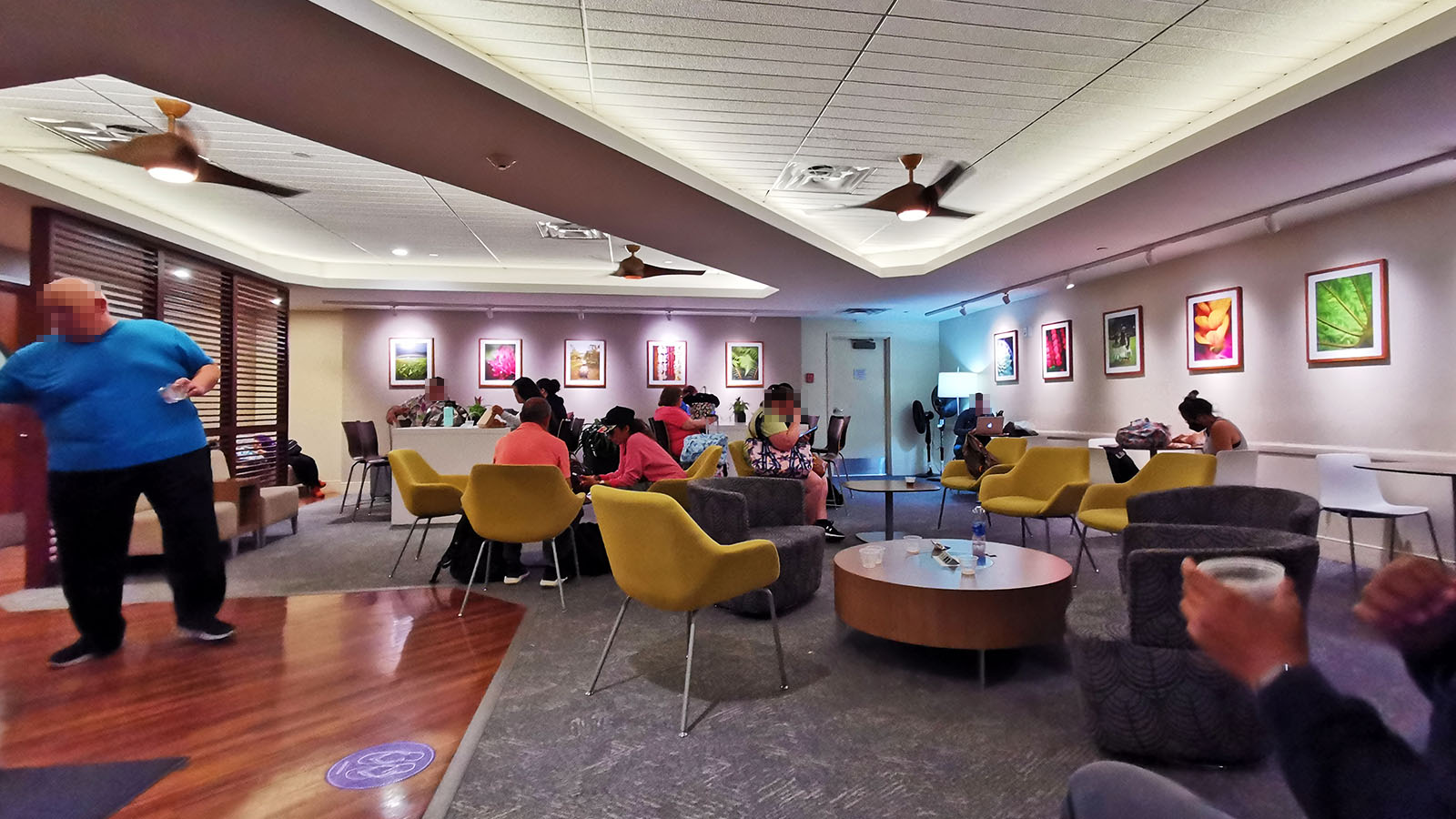 Passengers working and relaxing in the Hawaiian Airlines Premier Club in Honolulu