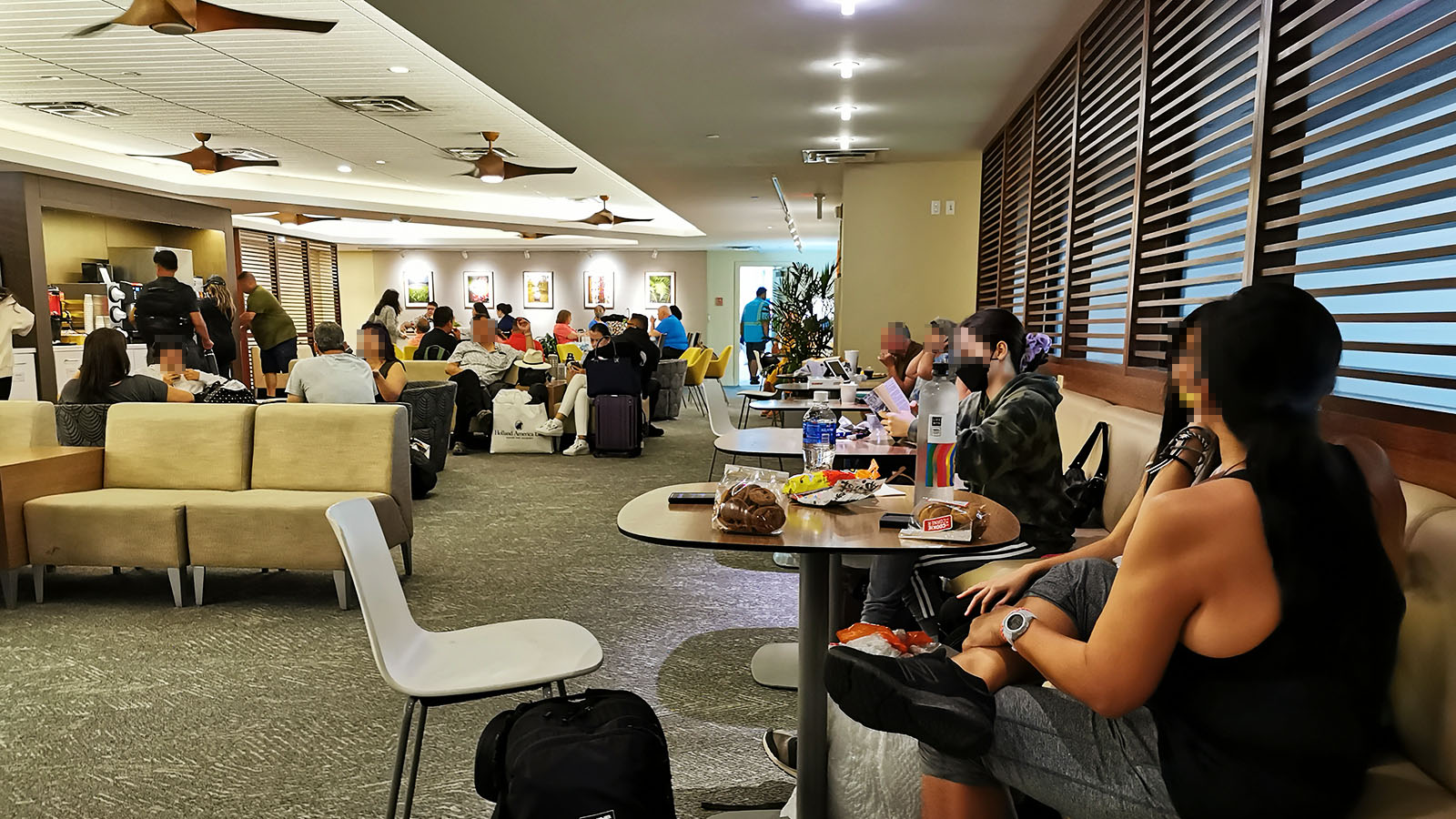 Passengers in the Hawaiian Airlines Premier Club in Honolulu