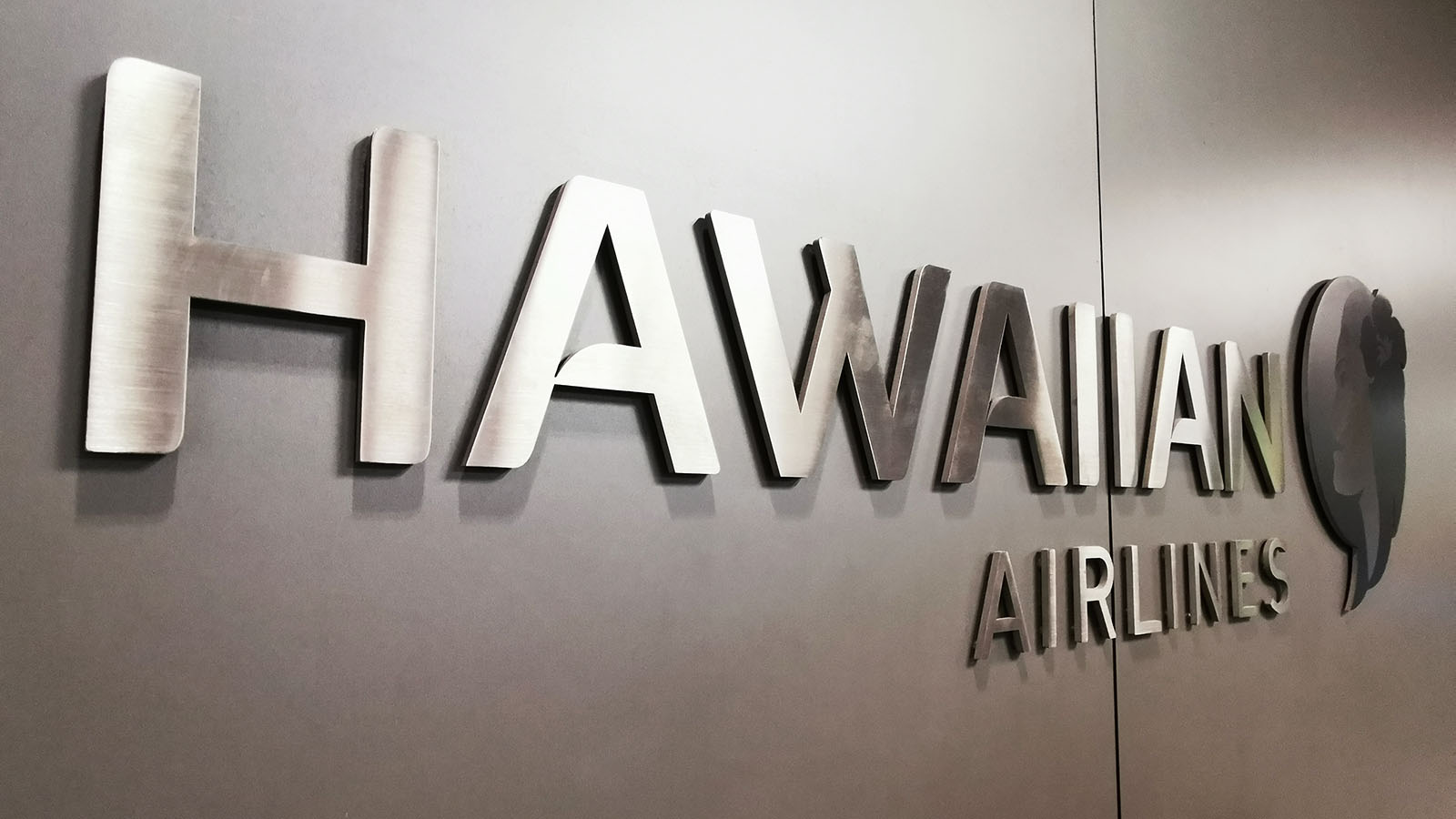 Hawaiian Airlines logo outside the Premier Club lounge in Honolulu