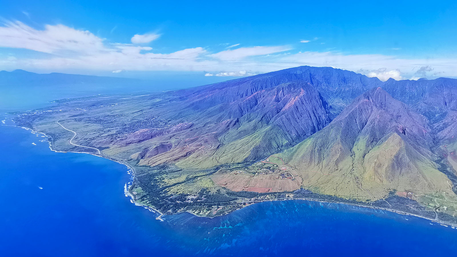 Use the window seat to take photos of Hawaii's mountains