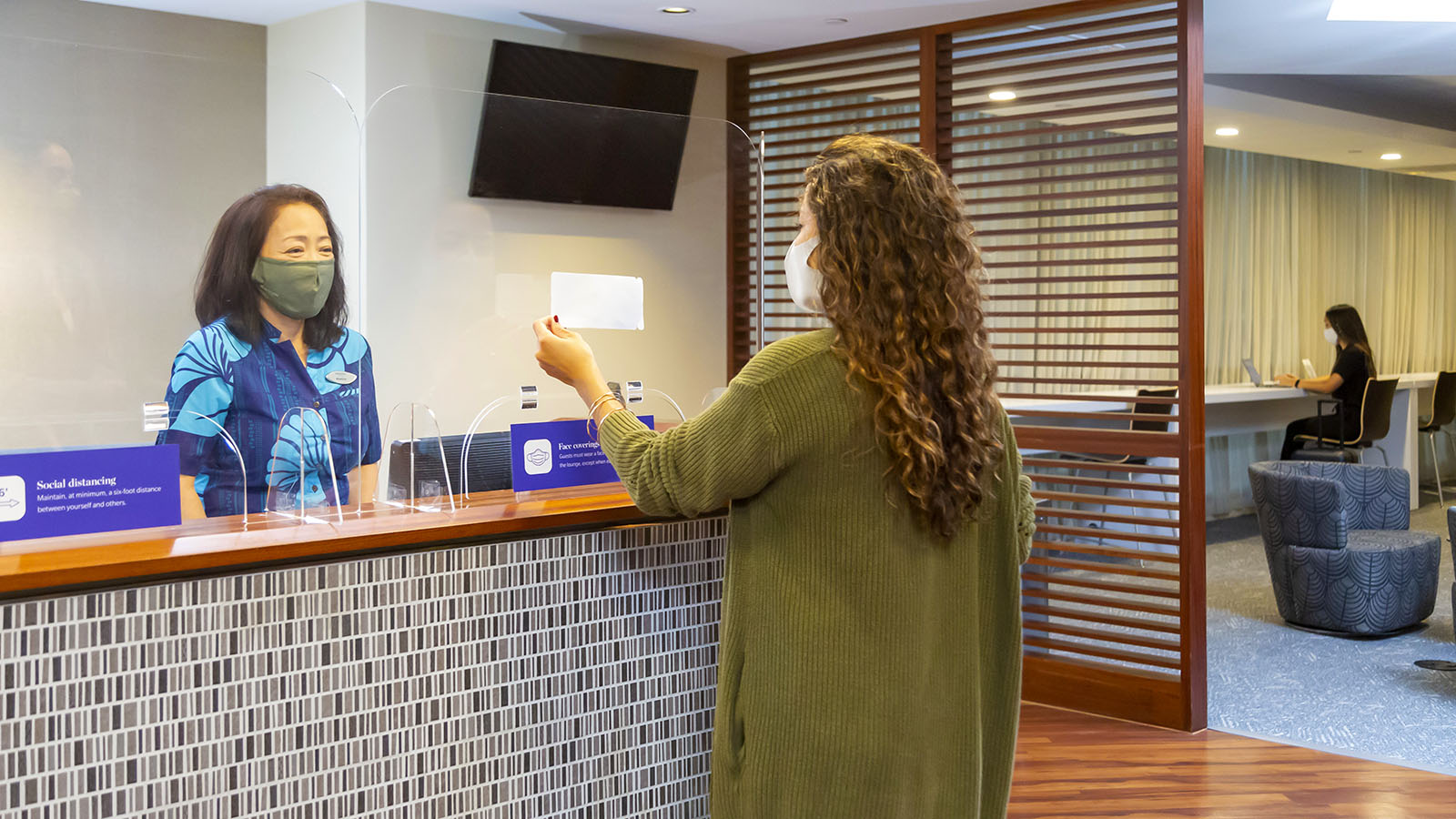 Reception desk inside Hawaiian Airlines' The Plumeria Lounge in Honolulu