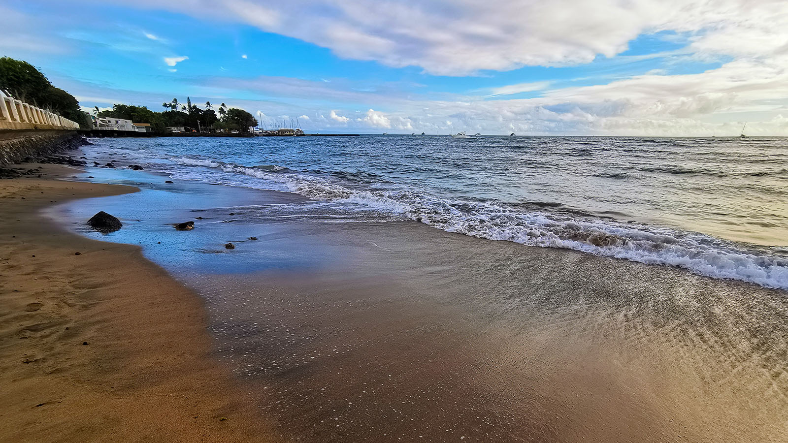 Sky reflects on beach in Hawaii