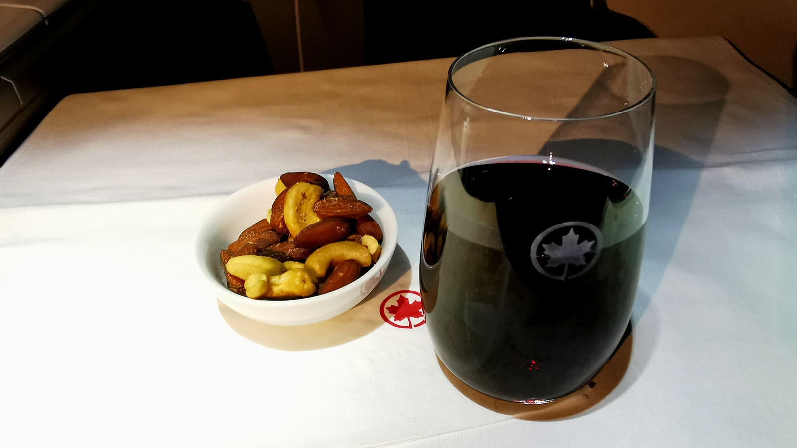 Red wine and snacks in Air Canada Boeing 787 Signature Class