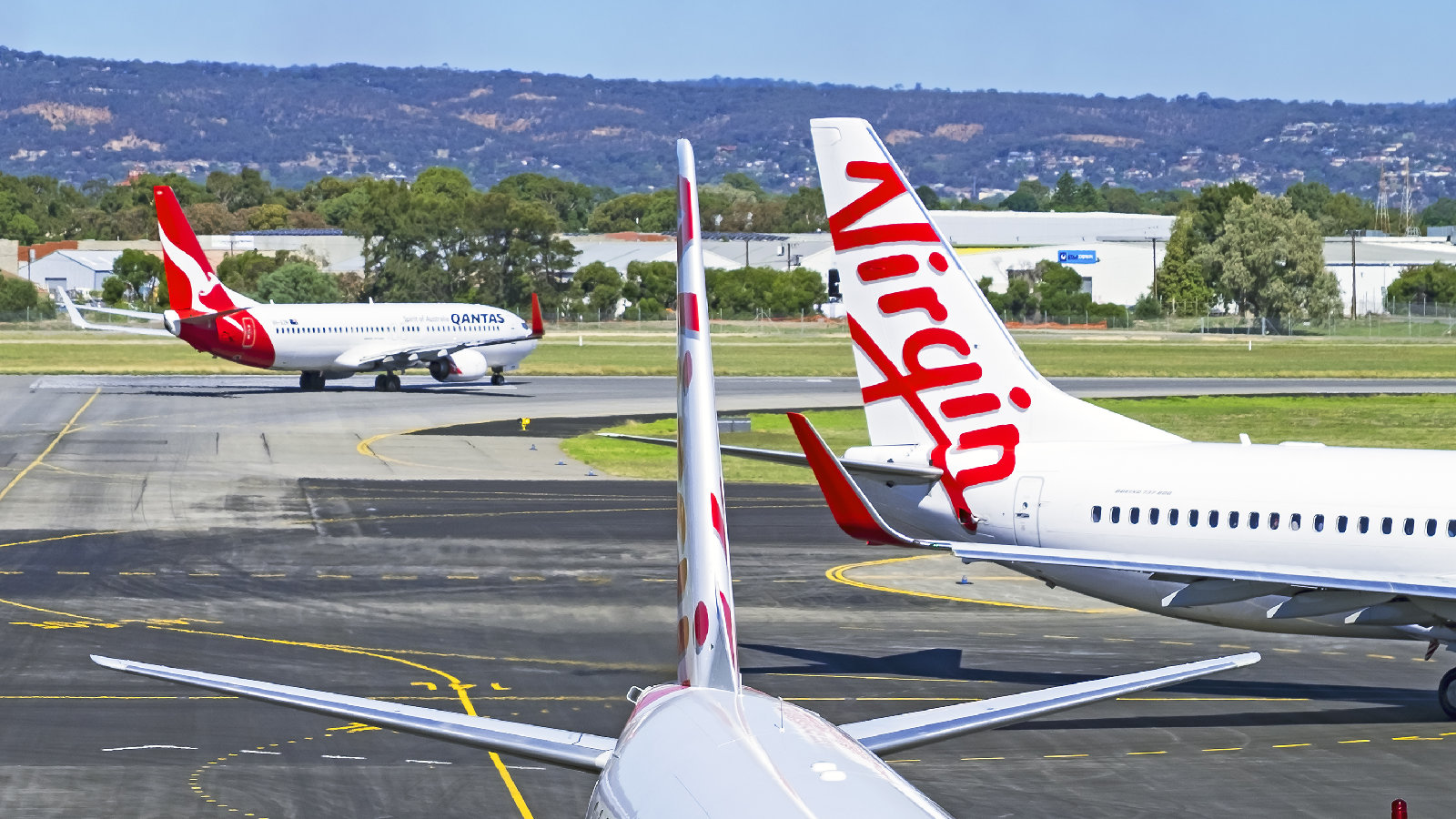Qantas and Virgin Australia planes on tarmac