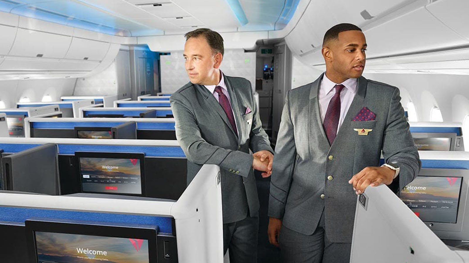Flight attendants in Delta One Suites Business Class
