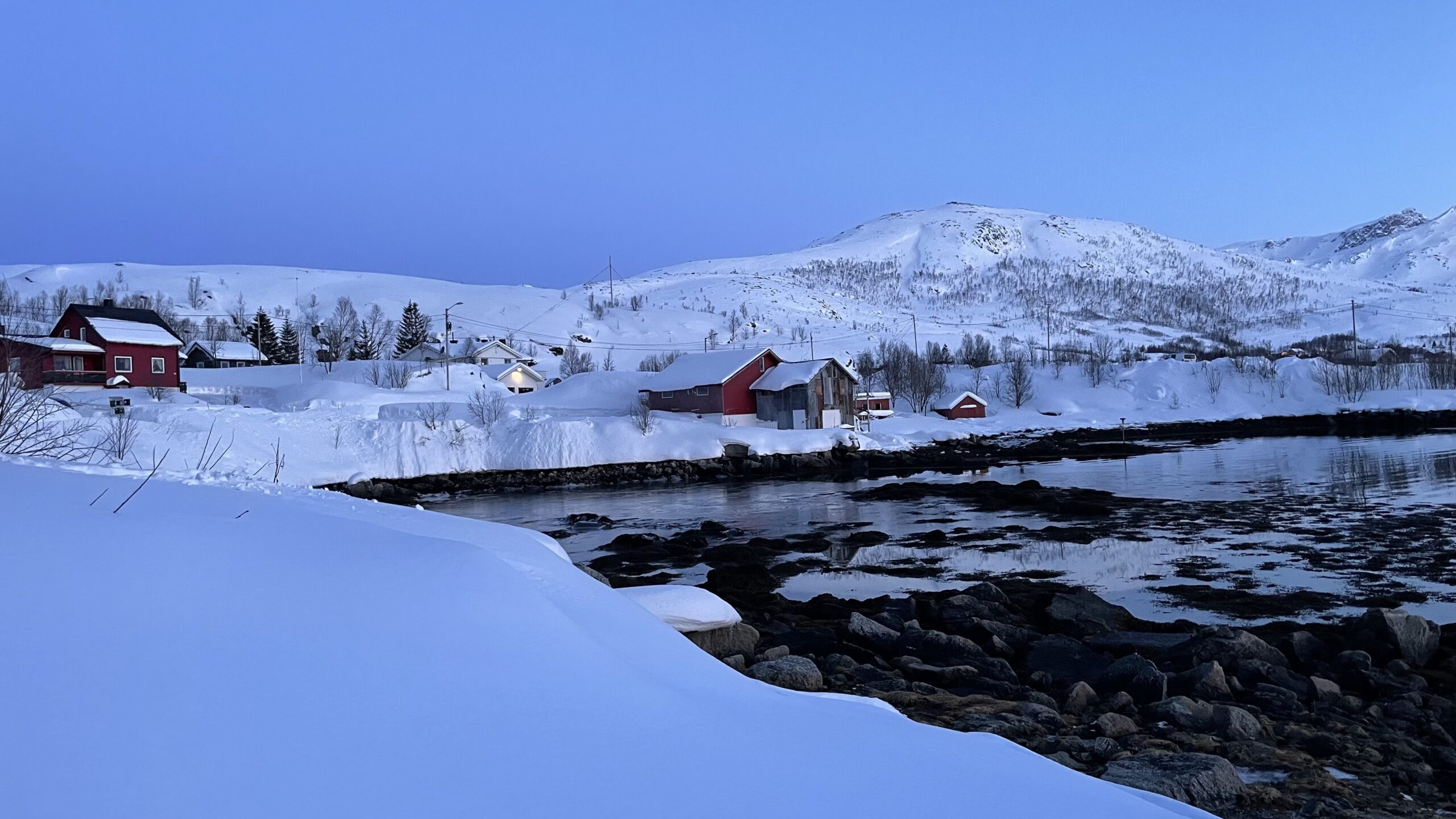 Snow Covered Tromso Norway Houses Beside Lake