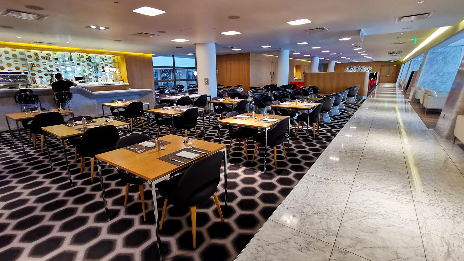 Seating for meals in the Qantas Los Angeles International First Lounge