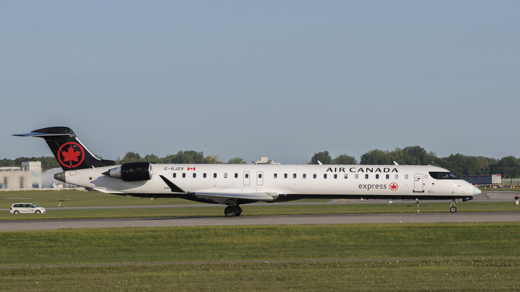 Exterior of Air Canada Express Bombardier CRJ900 plane with Business Class.