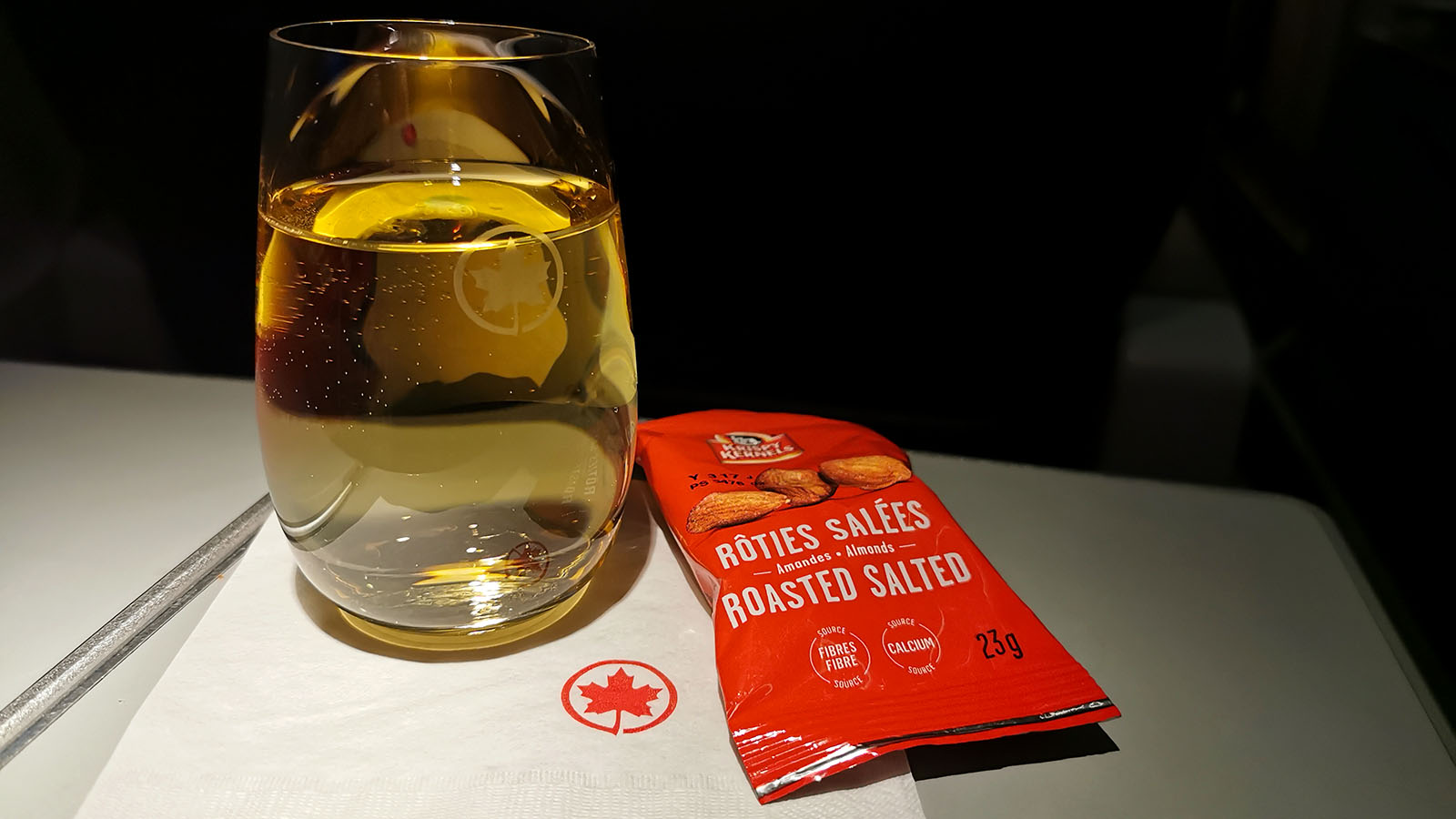 Glass of white wine in Air Canada Bombardier CRJ900 Business Class