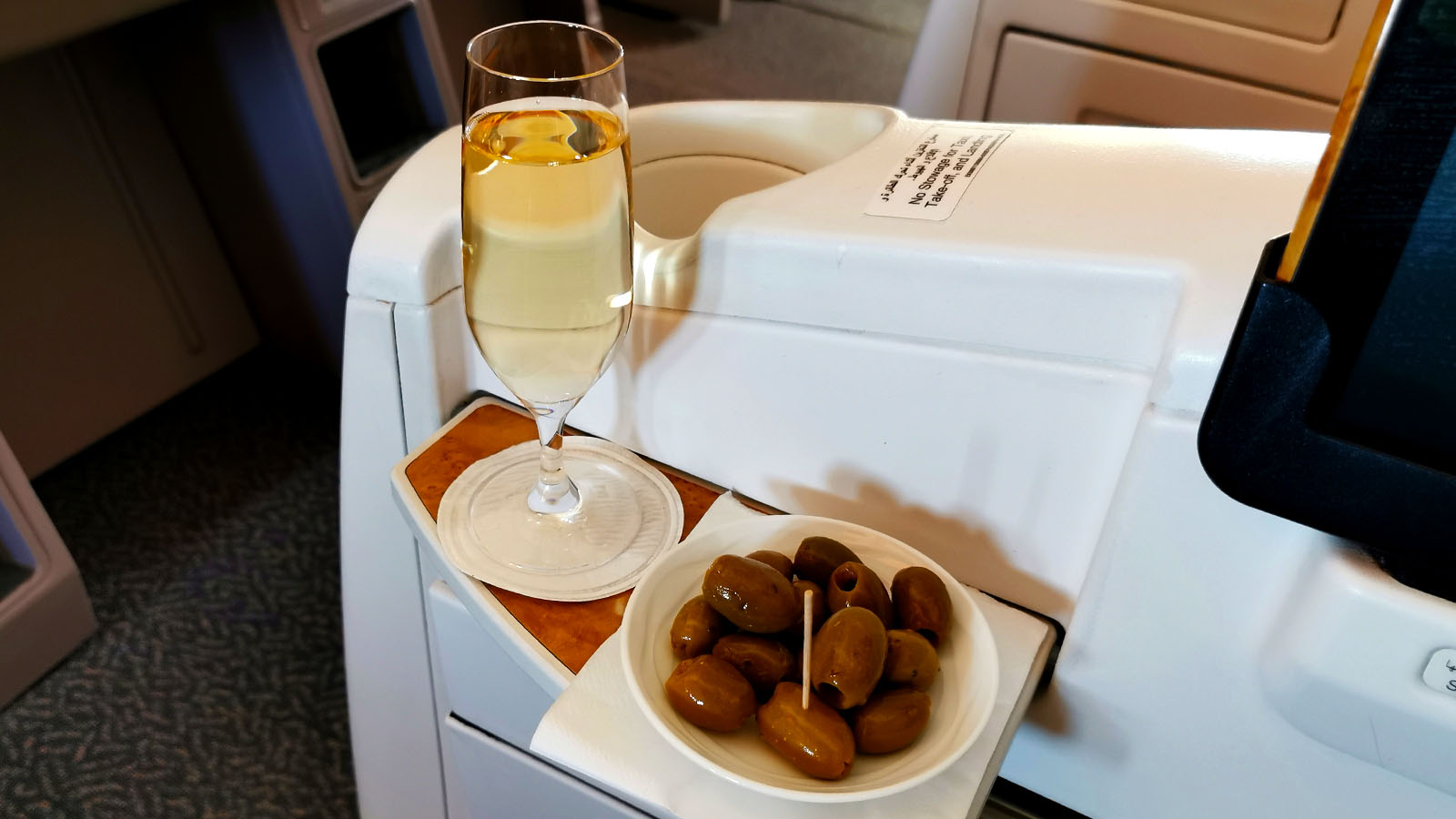 Veuve Clicquot and olives in Emirates Boeing 777 Business Class