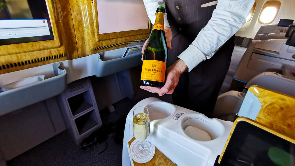 Champagne service in Emirates Boeing 777 Business Class