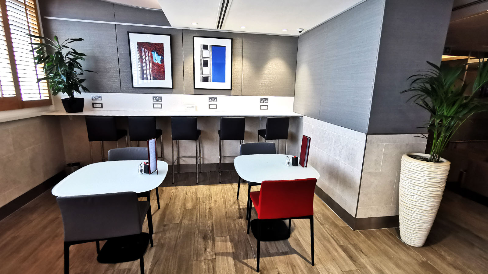 Meal tables in the American Airlines Arrivals Lounge at London Heathrow