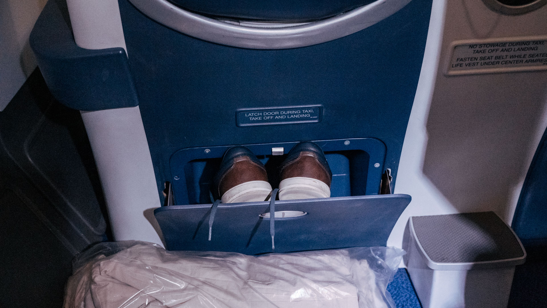 South African Airways A340 shoe compartment.