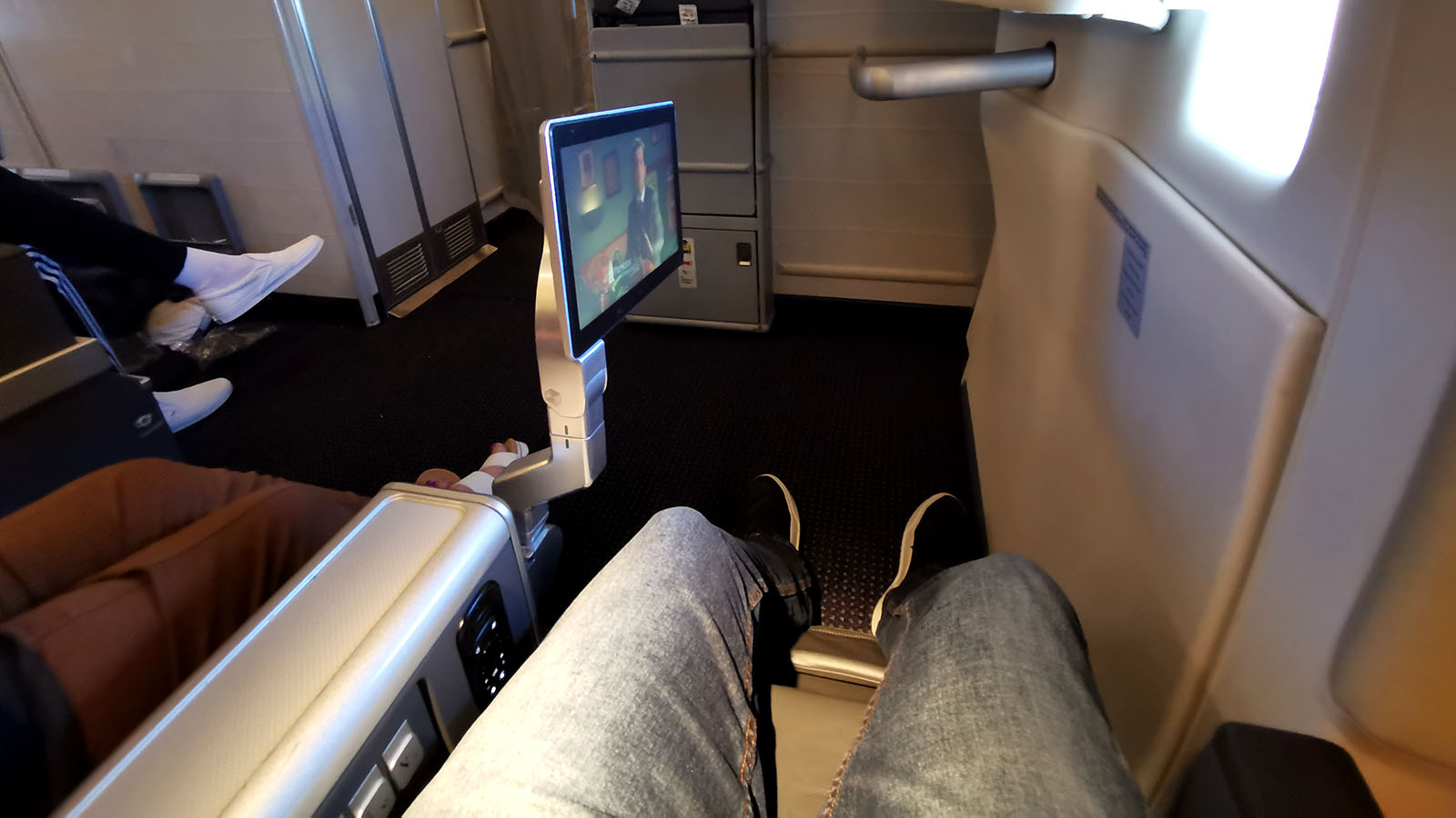 Feet out in American Airlines Premium Economy