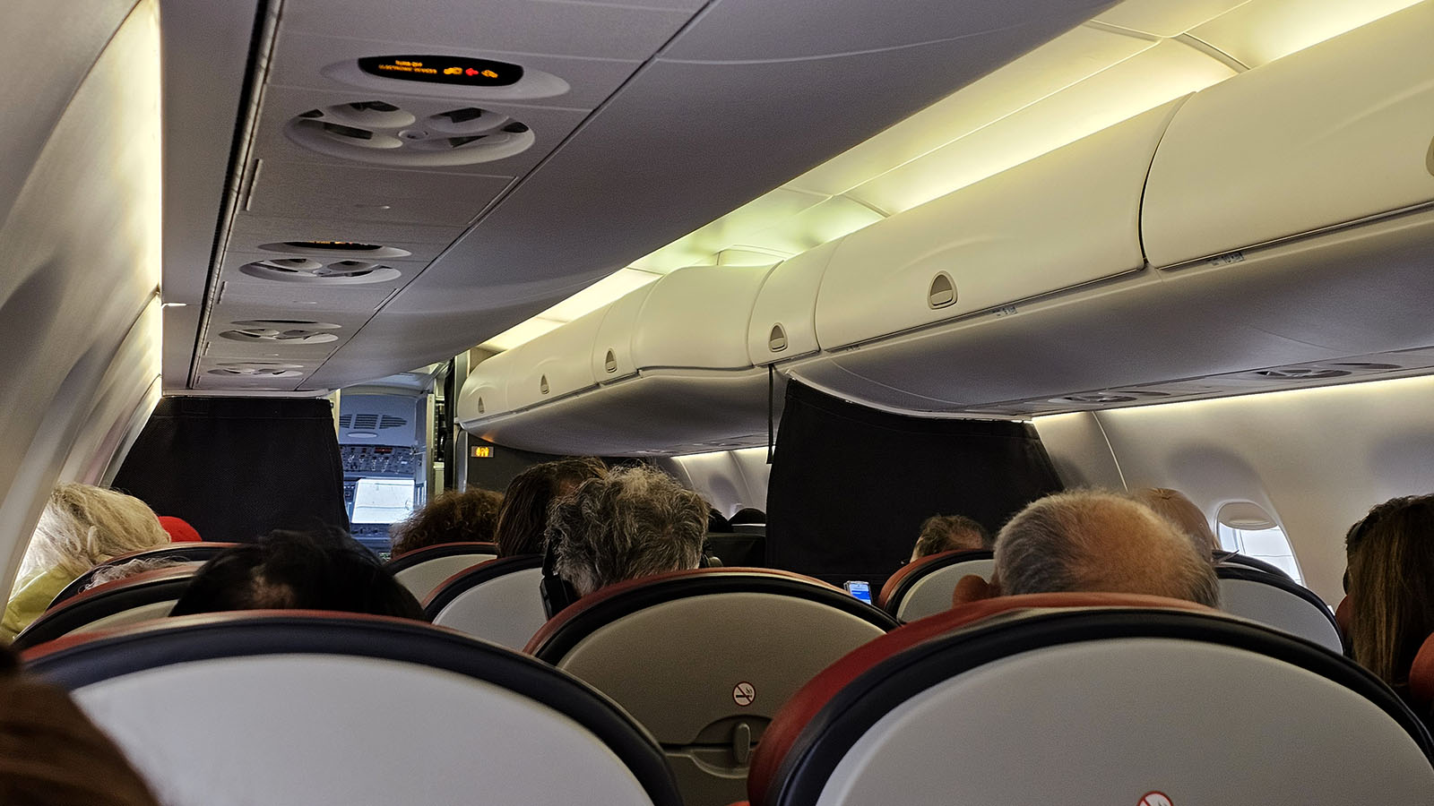 People in American Eagle Embraer E175 Economy Class