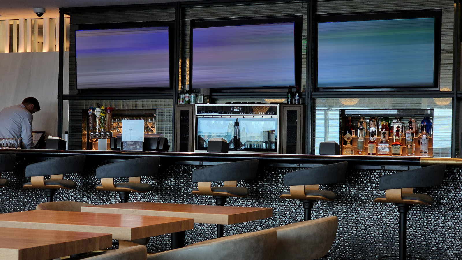 Beverage service in the Admirals Club in Denver, Colorado