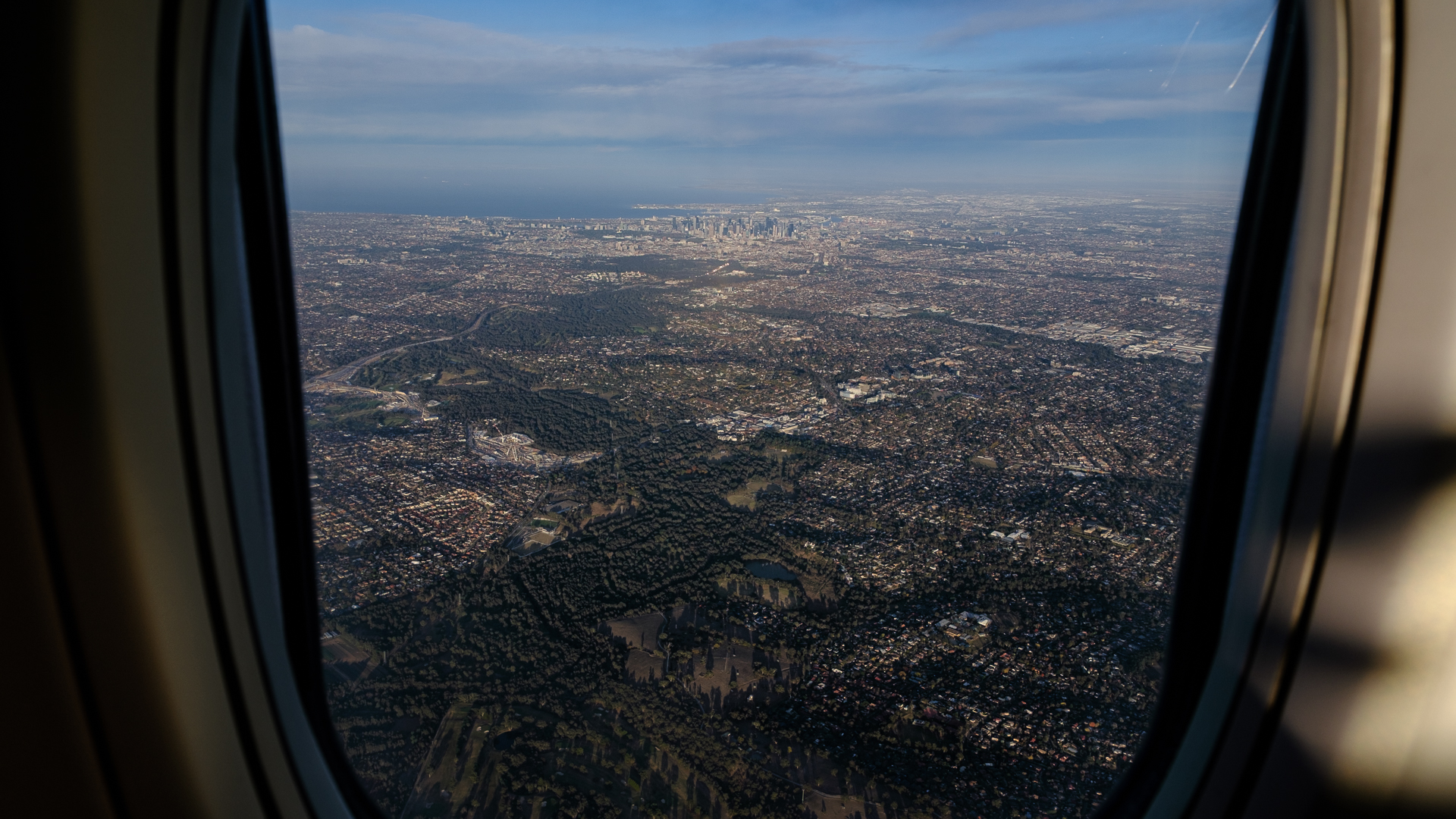 Melbourne through the window of a Qantas 737