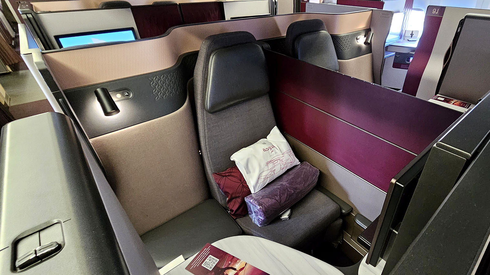 Two passengers together in Virgin Australia Qsuite