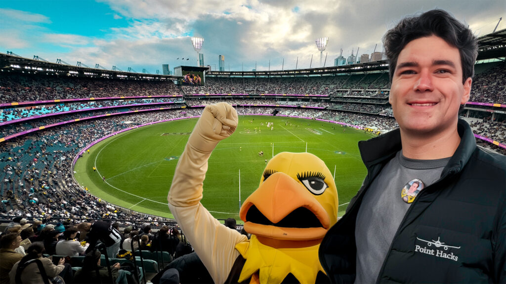 Joshua Weckert with the Hawthorn mascot overlooking the MCG