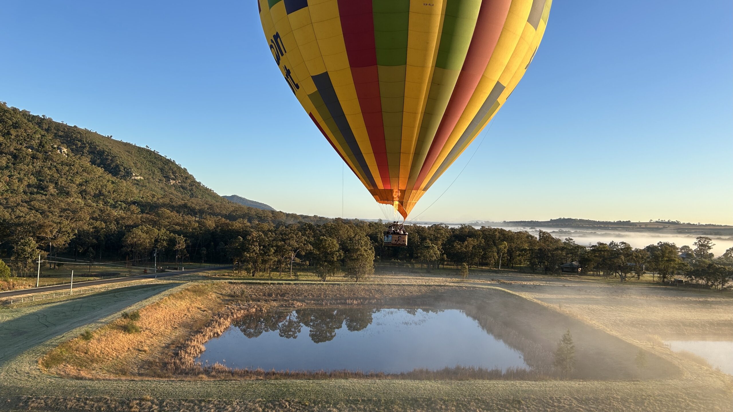 Hunter Valley Hot Air Balloon hovering over Lake Point Hacks by Daniel Sciberras